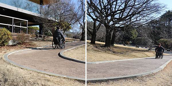 写真：蛇行しながらつづく坂道を上がる編集部員